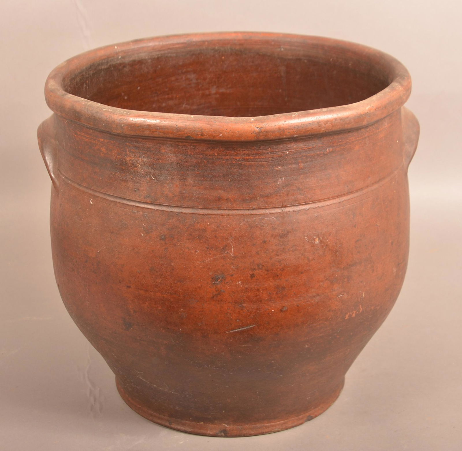 Pennsylvania 19th Century Redware Storage Crock.: Large Pennsylvania 19th Century Glazed Redware Storage Crock. Bulbous form with semi-rounded rim, tooled shoulder and applied lug handles. 13-1/2"h. x 14-1/2" diam. Condition: Good with minor wear.
