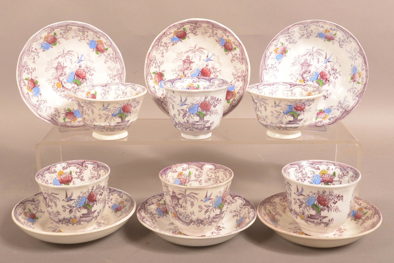 6 Purple Transfer Ironstone Florilla Cups and Saucers.: Six Purple Transfer Ironstone China Florilla Pattern Cups and Saucers. Saucers 6" diam. Condition: Good with chips.