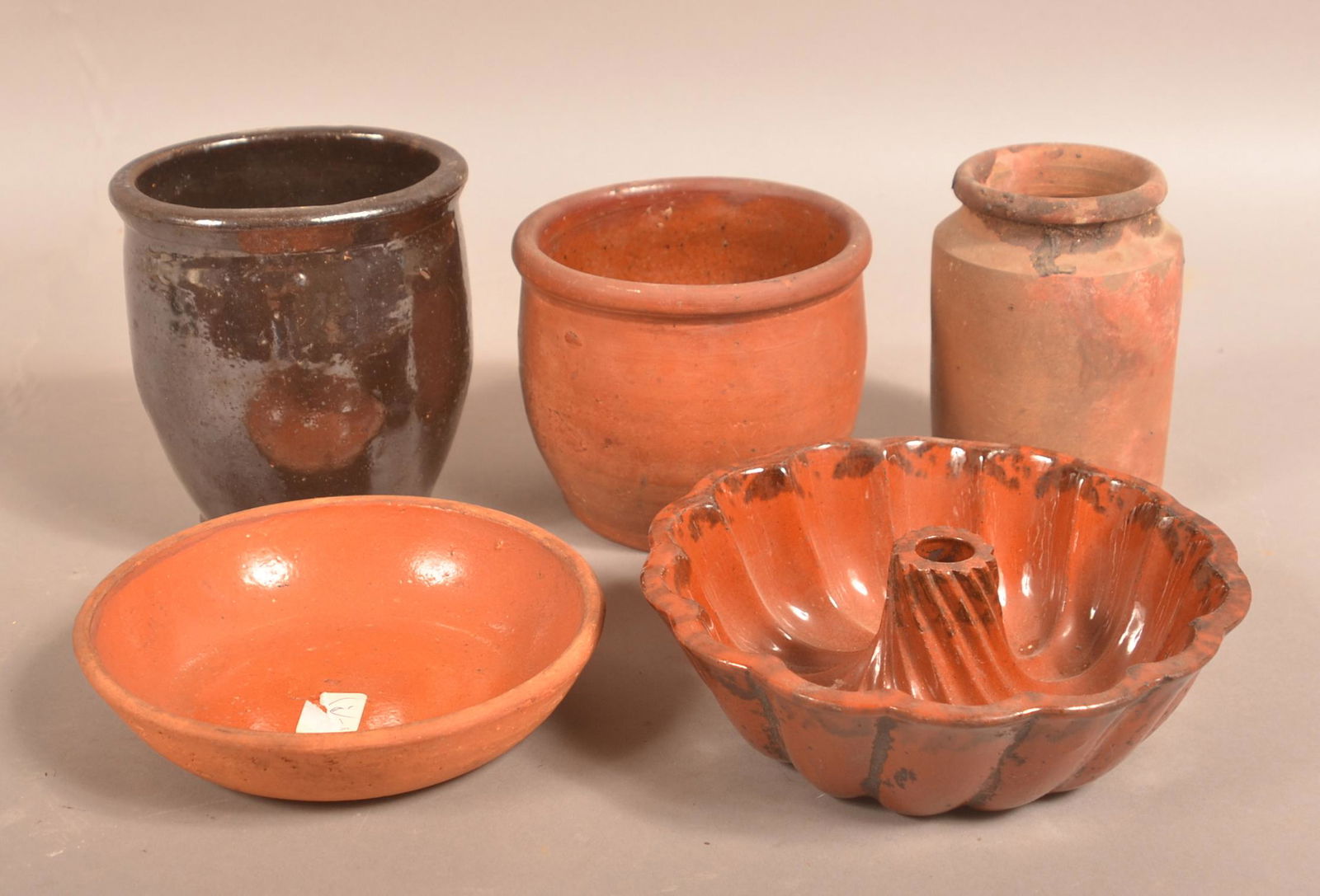 Lot of Antique Glazed Redware Items.: Lot of Antique Glazed Redware Items. Including Three Storage Jars, Turks Mold and Small Bowl. Largest jar measures 5-3/4"h. Condition: Good with minor chips.