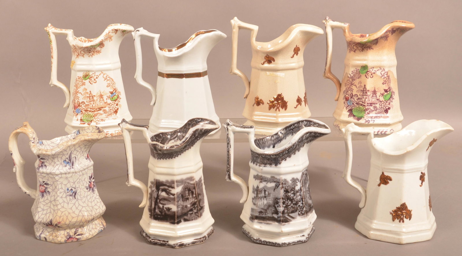 8 Transfer and Luster Ironstone Cream Pitchers.: Eight Transfer and Luster-Decorated Ironstone Cream Pitchers. Tallest 5-1/2"h. Condition: Good.