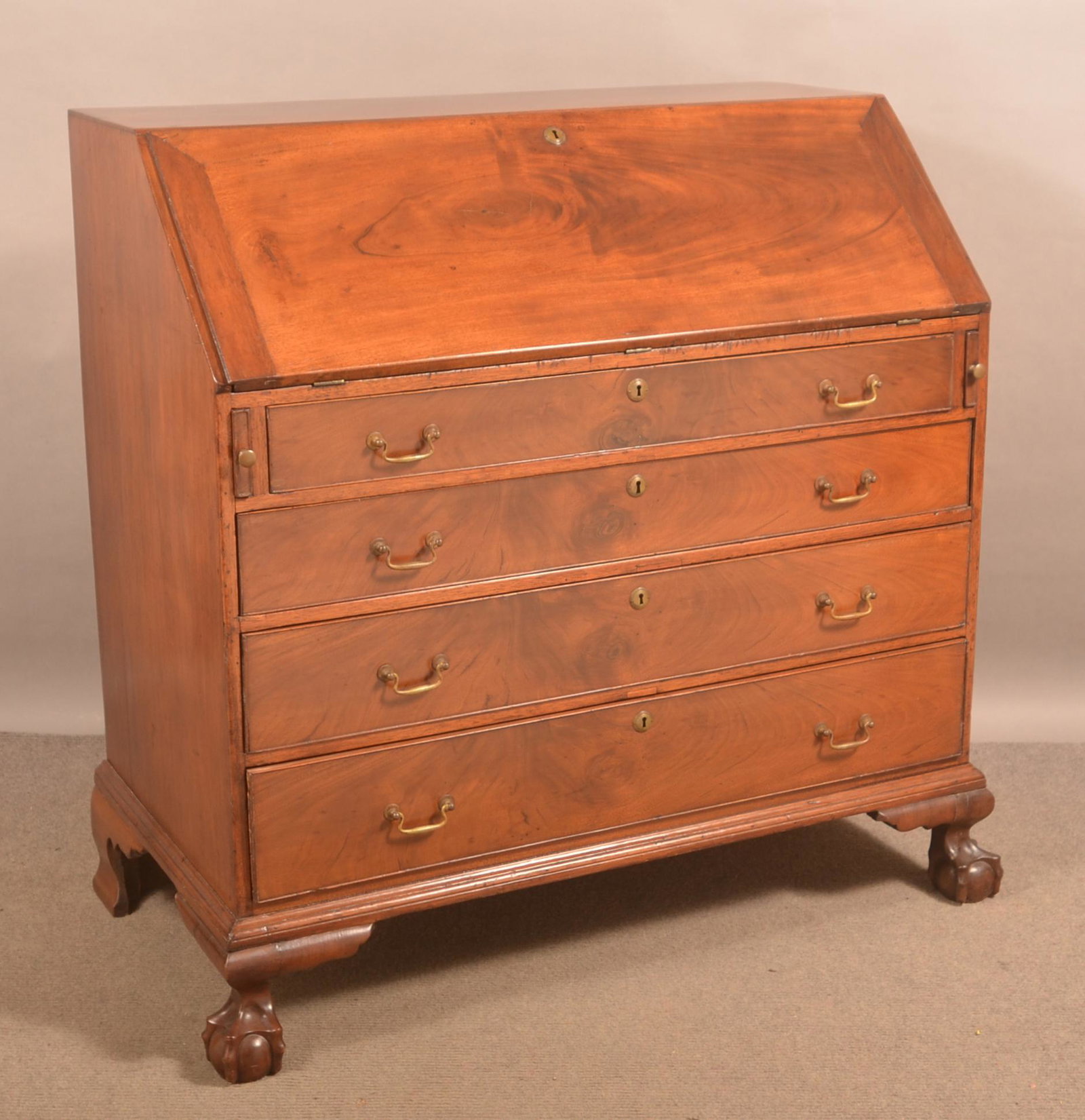 American Chippendale Mahogany Slant-Lid Desk.: American Chippendale Mahogany Slant-Lid Desk. Fitted interior and claw and ball feet. 46-1/2"h. x 48"w. x 26"d. Condition: Good with wear and minor loss.