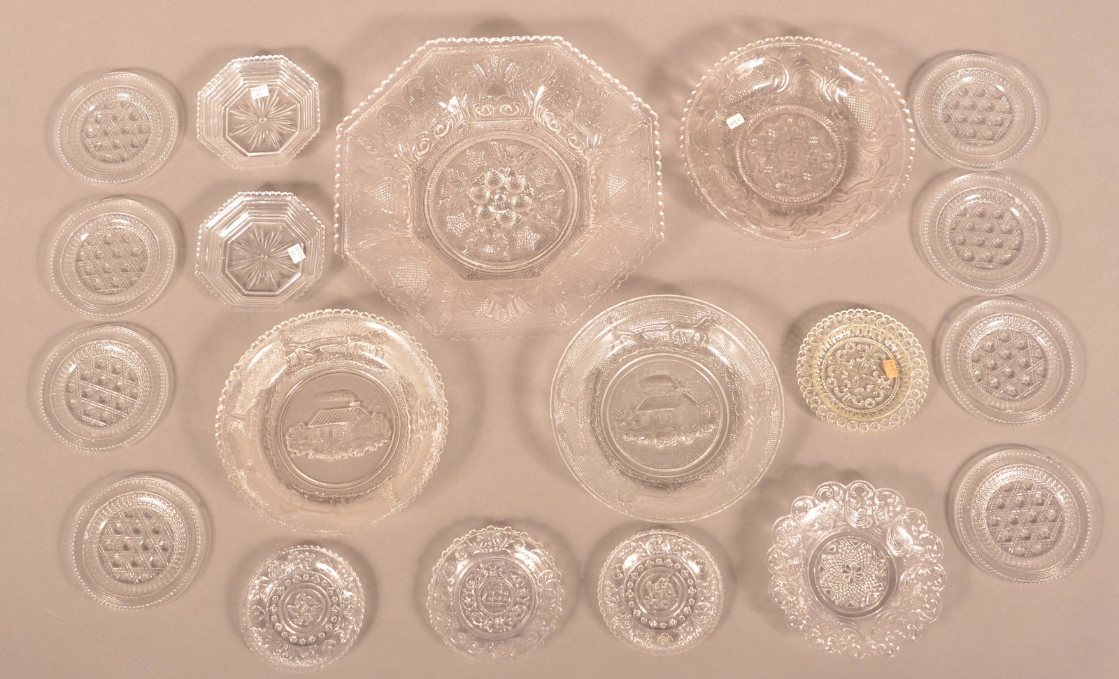 19 Sandwich Glass Colorless Flint Cup Plates and Bowls.: Nineteen Sandwich Glass Colorless Flint Cup Plates and Bowls. 3-3/8" to 9-1/4" diam. Condition: Good with chips.