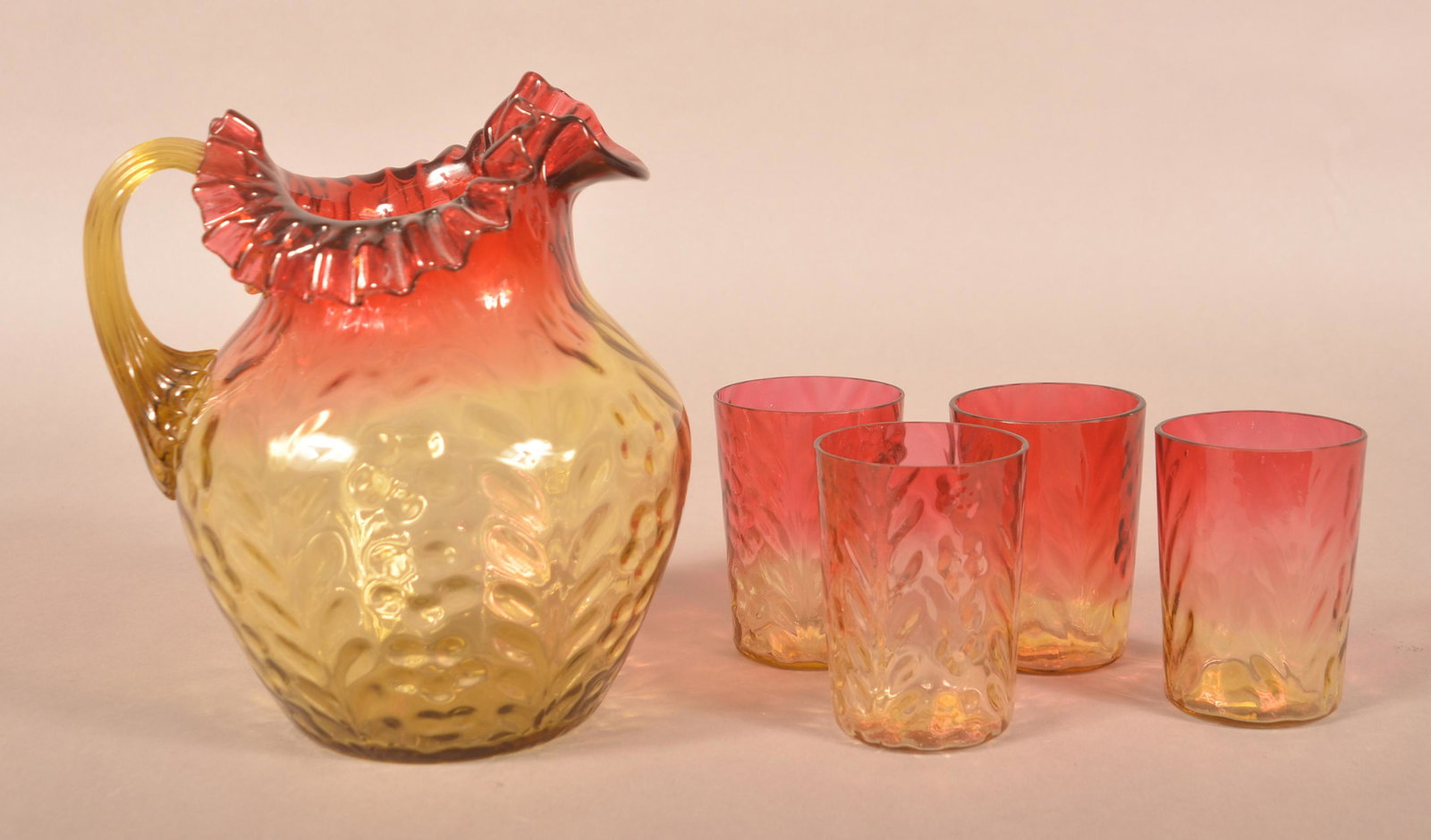 Amberina Glass Inverted Daisy 5-Piece Water Set.: Antique Amberina Glass Inverted Daisy 5-Piece Water Set. 8" fluted top pitcher and four 3-3/4" tumblers. Condition: Very good.
