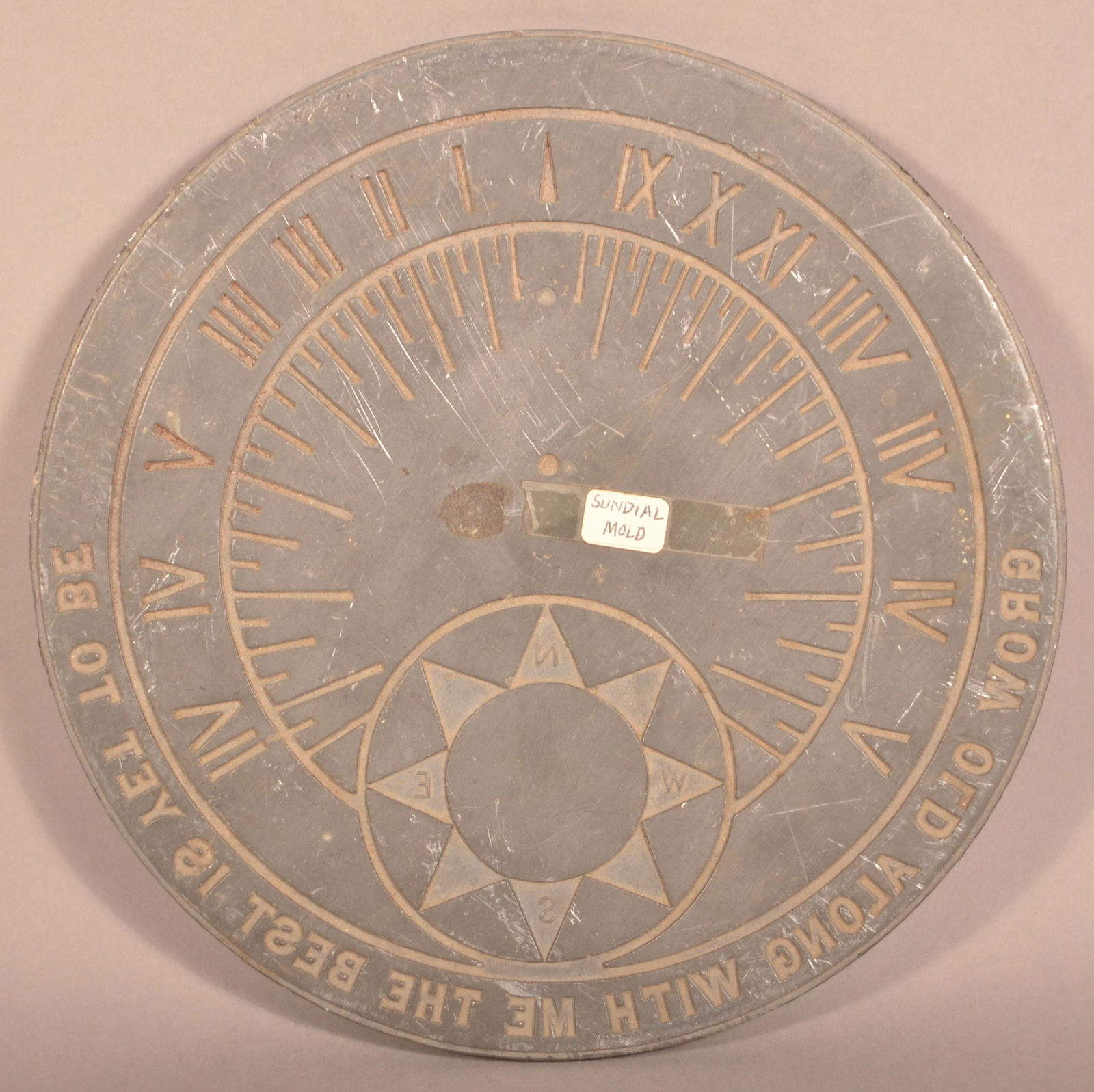 Circular Lead Sundial Mold.: Circular Lead Sundial Mold. "Grow Old Along With Me The Best Is Yet To Be". 9-3/8" diam. Condition: Good with wear.