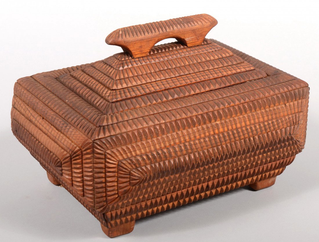 Chip Carved Tramp Art Jewelry Box. Rectangular pyr: Chip Carved Tramp Art Jewelry Box. Rectangular pyramid shaped sides and lid of low profile carving. Lid has elongated handle and is hinged to reveal a white satin lined compartment. 6 5/8"h. X 10 1/2"