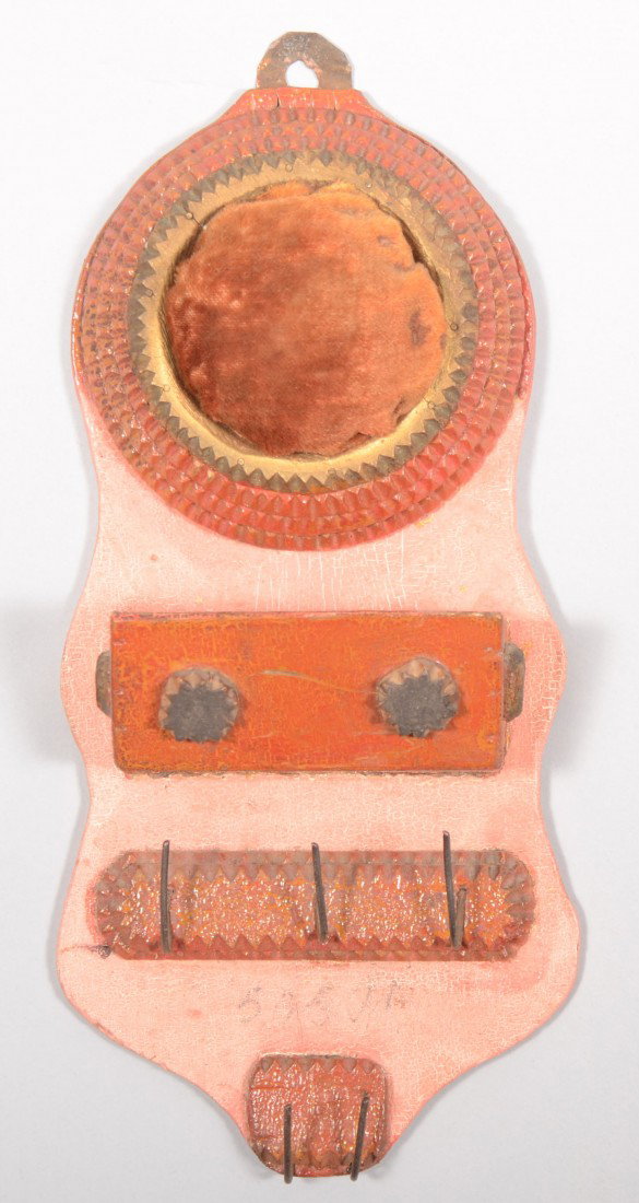 Painted Chip Carved Wall Pocket with Pin Cushion. : Painted Chip Carved Wall Pocket with Pin Cushion. Pink painted and scalloped backboard supports a layered round velvet pin cushion above a disc decorated pocket in red and a series of five wire hooks 