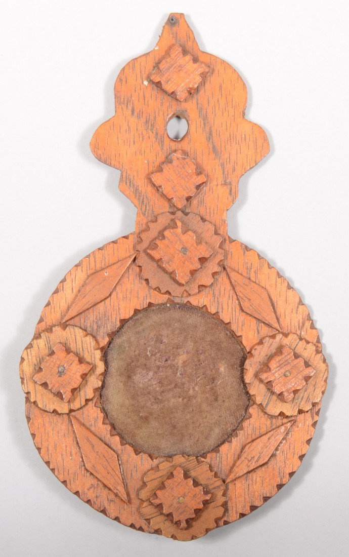 Wall Hanging Pin Cushion. Circular chip carved bac: Wall Hanging Pin Cushion. Circular chip carved backboard with applied geometric shapes and shaped hanger. Velvet straw filled cushion in center. 7"h. X 4"w. Condition Good.