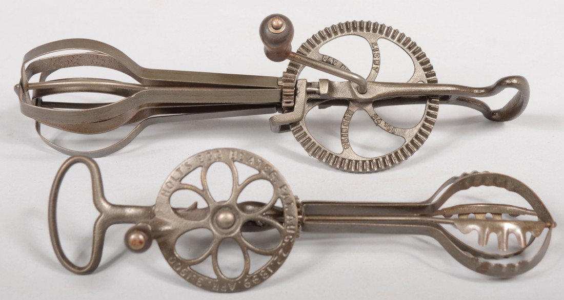 Two Iron Crank Egg Beaters. Marked: "Holt's Egg Be: Two Iron Crank Egg Beaters. Marked: "Holt's Egg Beater" with patent dates 1899 thru 1900. 10 1/2"l. and "Light Running, The Taplin Mfg. Co., New Britain, Conn., dated 1908." 12 1/2"l. Condition: Both 