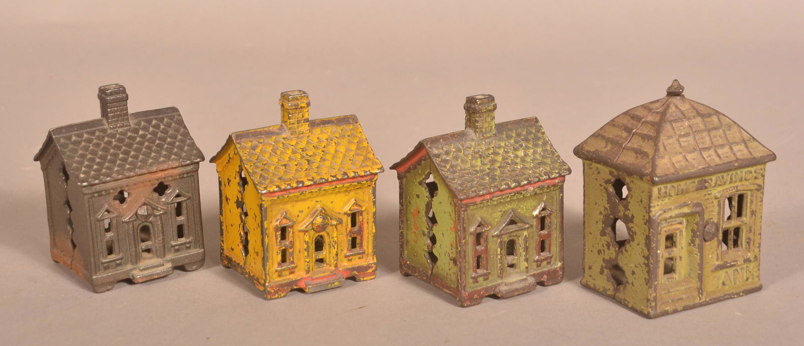 Four Antique Cast Iron Building Still Banks. (1 of 3)