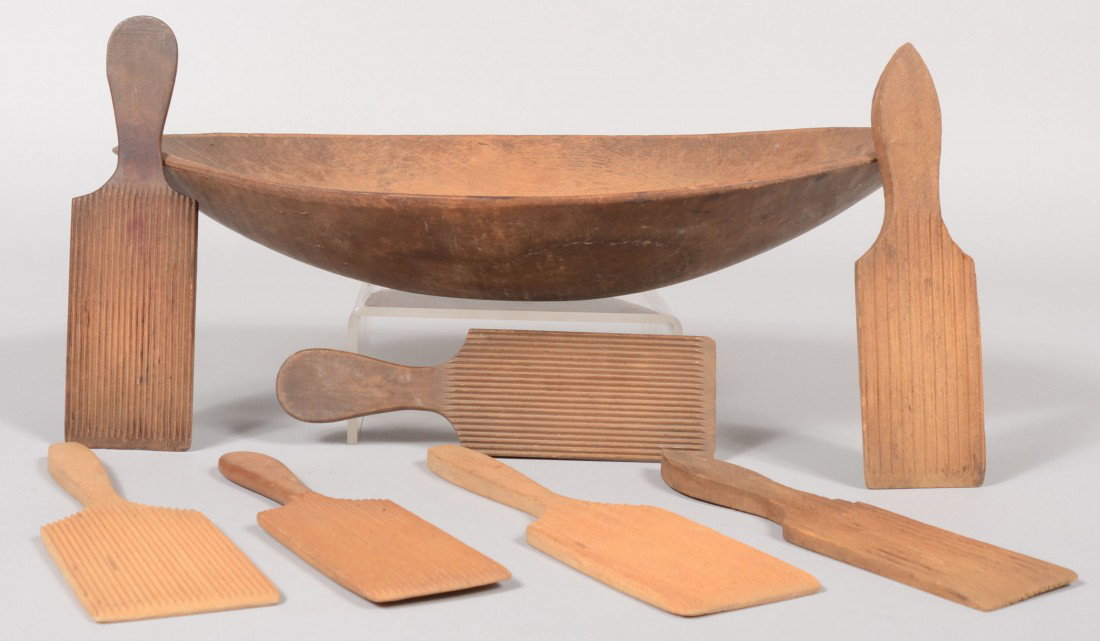 Wooden Kitchenware Group. An ovoid carved wood bowl: Wooden Kitchenware Group. An ovoid carved wood bowl, 18 3/4"l. along with seven reeded wooden butter paddles, 9 1/2"l. avg. ea. Condition: Bowl has crack in bottom. Paddles good.