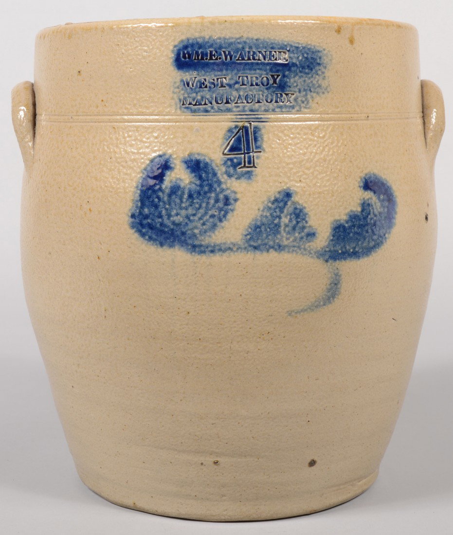 Large Cobalt Decorated Stoneware Crock. Marked unde: Large Cobalt Decorated Stoneware Crock. Marked under rim: "M. E. Warner, West Troy Manufactory, #4." and colored blue. Decoration of flower just below stamping. Applied crescent handles. 12 3/4"h. X 1