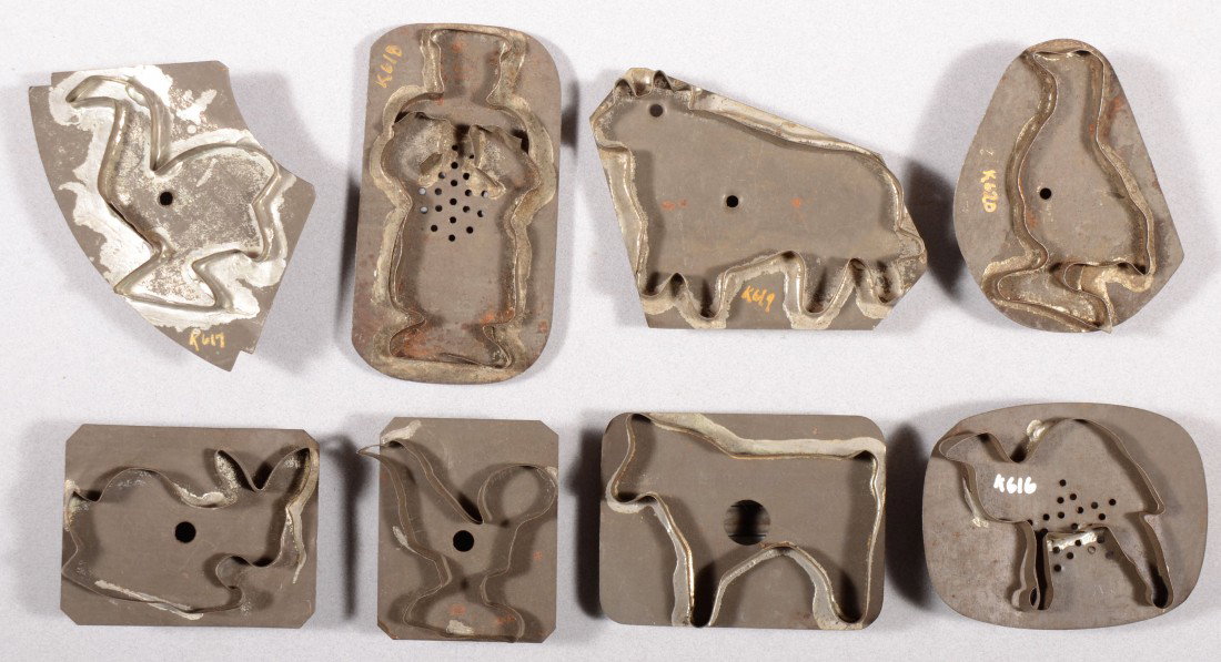 Tinned Sheet Iron Cookie Cutters. Eight shapes with: Tinned Sheet Iron Cookie Cutters. Eight shapes with handles including: geese, dog, bull, camel, rooster, rabbit and a baker man. Ave. size: 4"l. Condition: Good with use wear.
