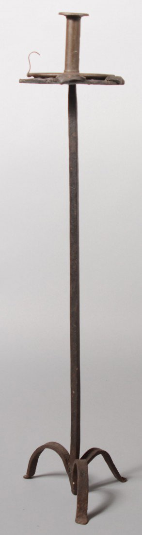 Three Legged Wrought Iron Stand with an open work : Three Legged Wrought Iron Stand with an open work top. Square shaft on three curved legs and a circular top with applied pierced decoration, 27 1/4"h. Comes with a pressed sheet iron chamber candle st