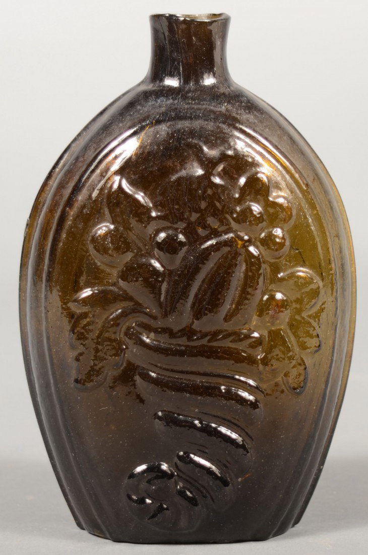 Olive Amber Cornucopia/Urn Flask, Coventry, CT Gla: Olive Amber Cornucopia/Urn Flask, Coventry, CT Glass Works, pontil mark with plain lip and heavy medial rib. (McKearin Glll-4). 6 3/4" high. Condition: good.