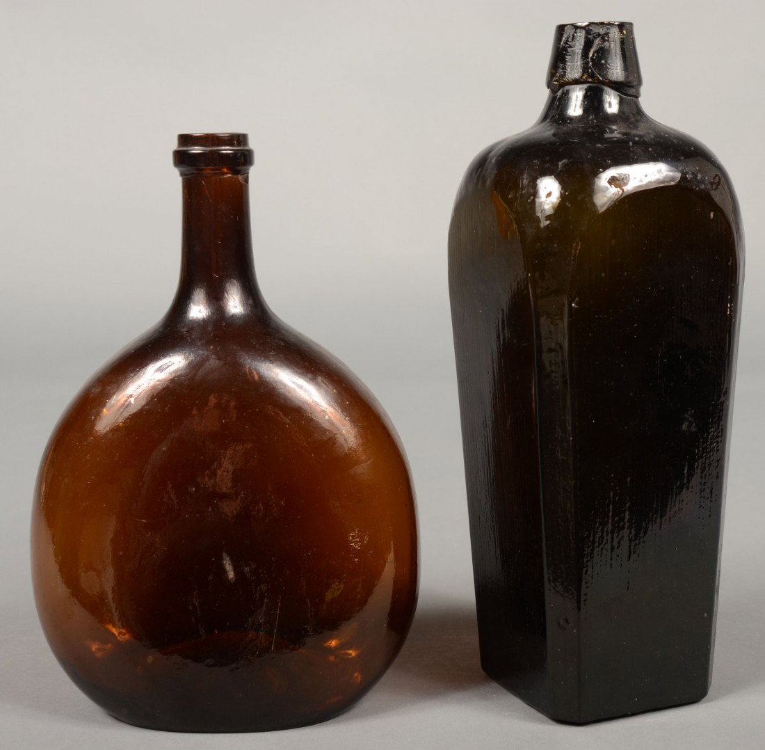 Two Blown Glass Bottles; 1st is a amber glass ches