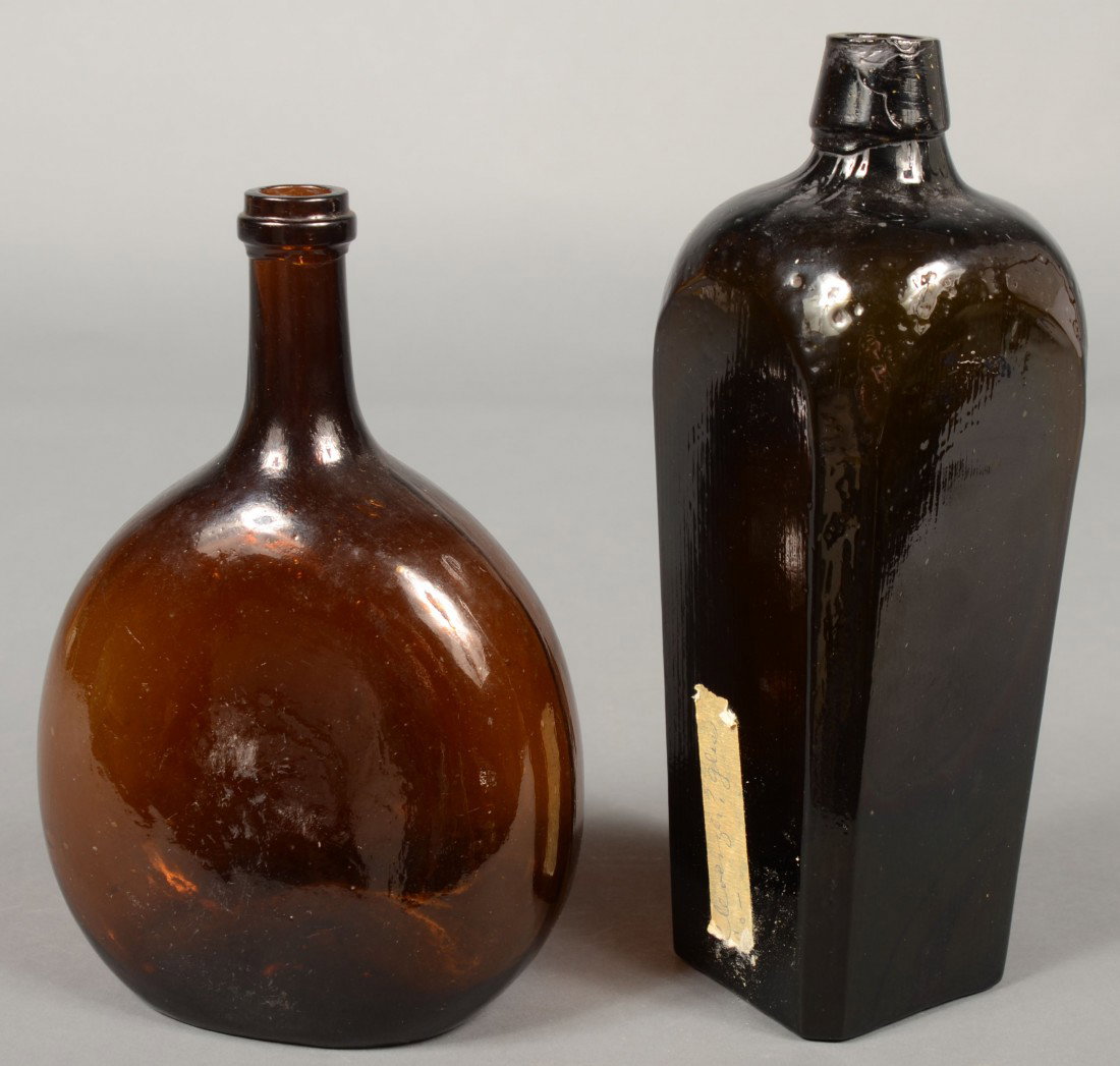Two Blown Glass Bottles; 1st is a amber glass ches - 2