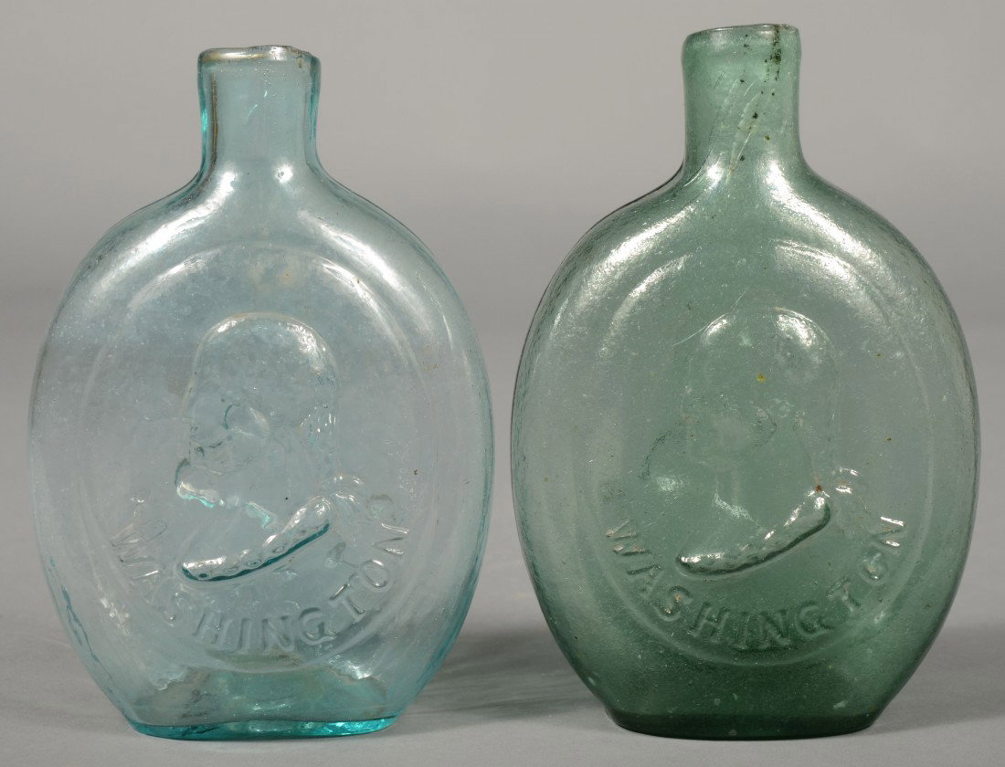 Two Blown Glass Washington/ Taylor Pint Size Flask: Two Blown Glass Washington/ Taylor Pint Size Flasks, aquamarine and green clear, Dyottville Glass Works, Philadelphia, PA, (McKearin Gl-50). Plain lip with pontil mark. 6 3/4" and 7" high. Condition: 