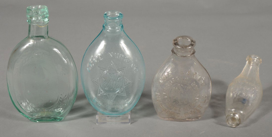 Three Nursing Bottles and a Half Pint Wreath Flask: Three Nursing Bottles and a Half Pint Wreath Flask including "THE EAGLE NURSING BOTTLE" and "ACME NURSING BOTTLE". Condition: good.