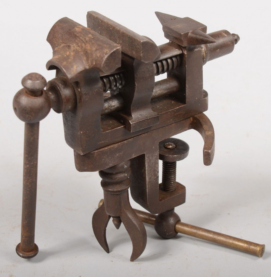 Adjustable Jeweler's / Clockmaker's Vise. No maker: Adjustable Jeweler's / Clockmaker's Vise. No maker's marks. 7"h. X 6 3/4"d. Condition: Good with use wear. Deck clamp with replaced brass bar.