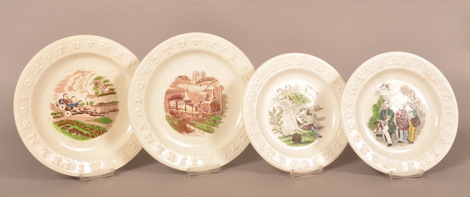 Four Transfer-Decorated Ironstone Alphabet Plates.: Four Transfer-Decorated Ironstone Alphabet Plates. Largest: 8-1/2" diam.