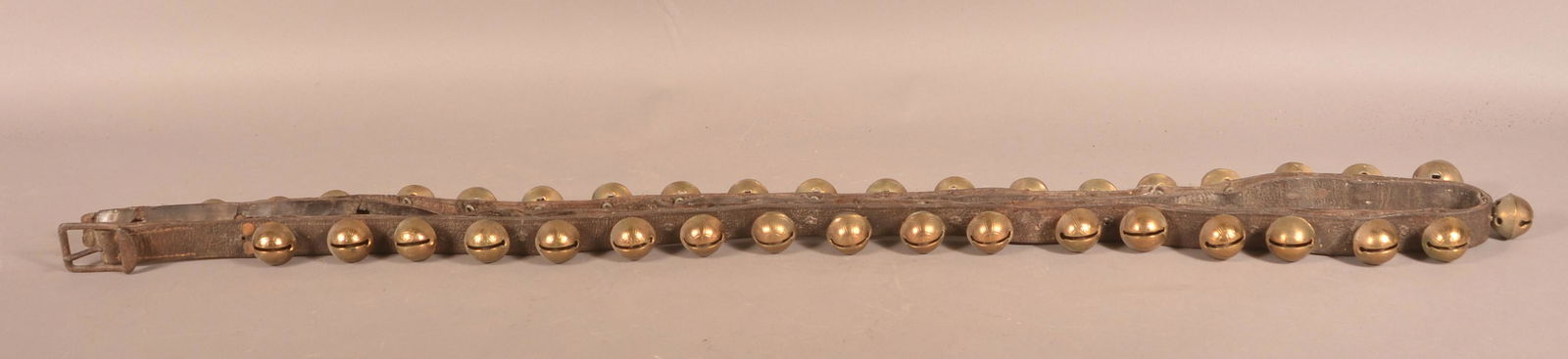 String of 37 Antique Brass Sleigh Bells. (1 of 3)