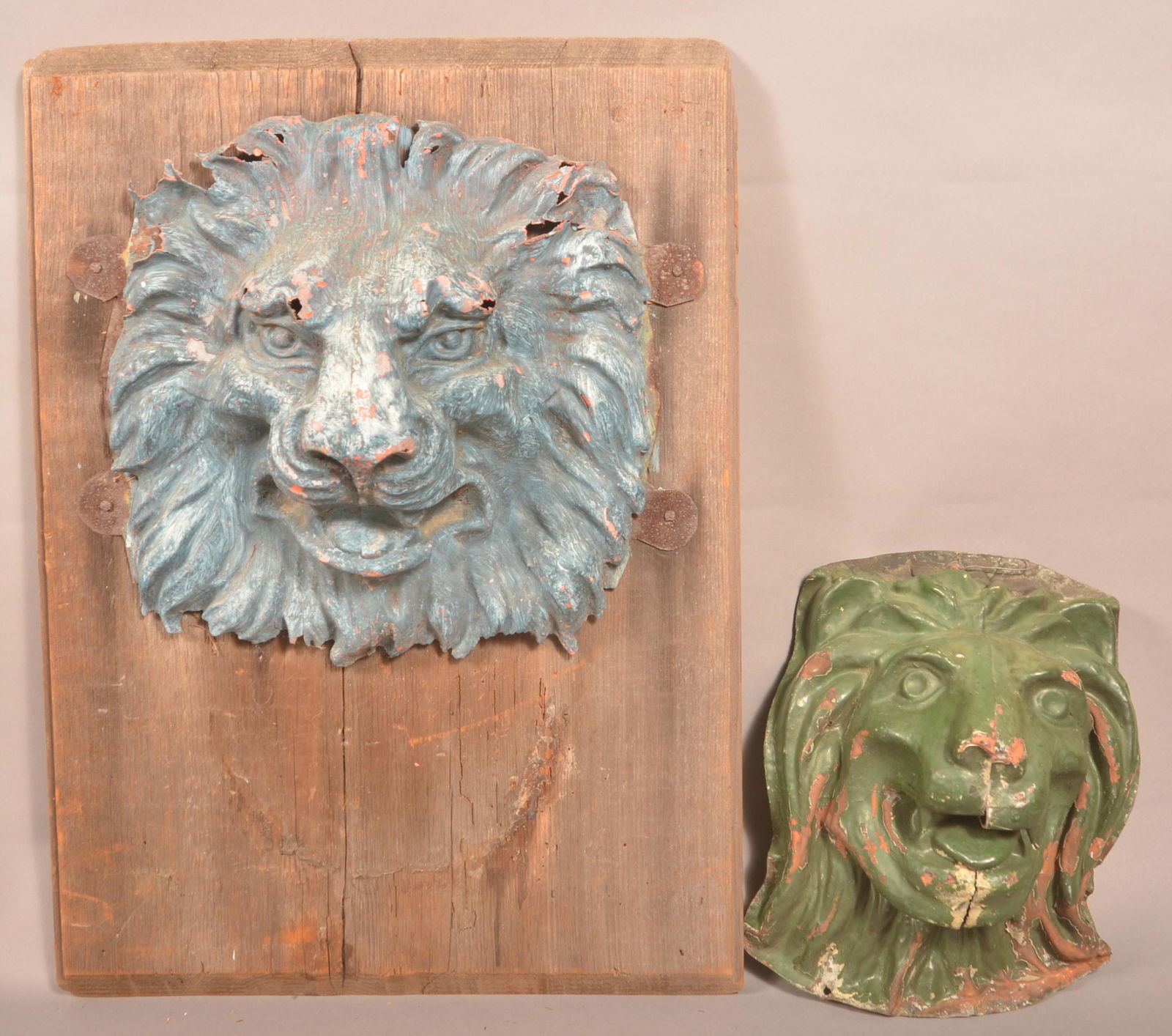 Two Antique Dimensional Tin Lion Heads. (1 of 4)
