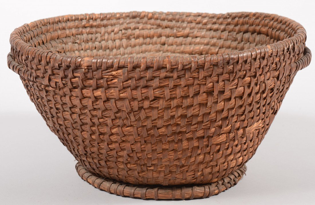 Large Open Rye Straw Basket. With two rib handles: Large Open Rye Straw Basket. With two rib handles and applied double foot rim. 8 1/2"h. X 15 1/2"dia. Condition: Some wraps lost on top rim, a few off handles and two lengths off foot rims.