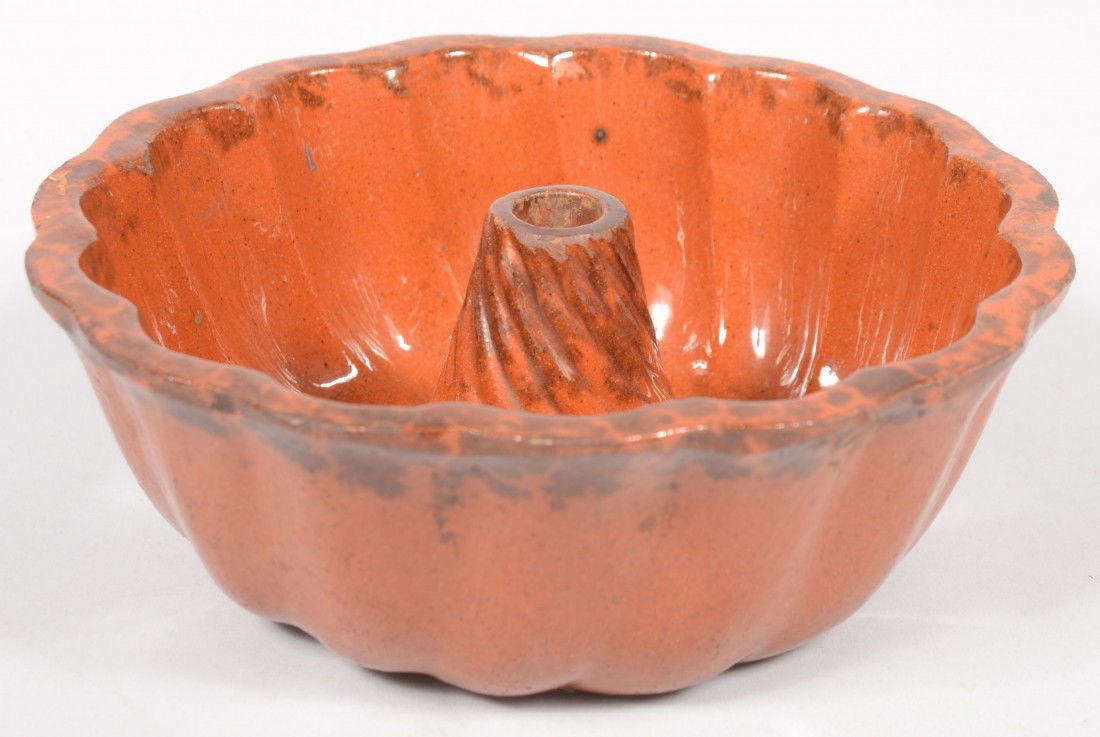 Redware Turk's Head Food Mold. Manganese spattered: Redware Turk's Head Food Mold. Manganese spattered around lobbed rim and nose. 9"dia. Condition: Nice example with use wear.