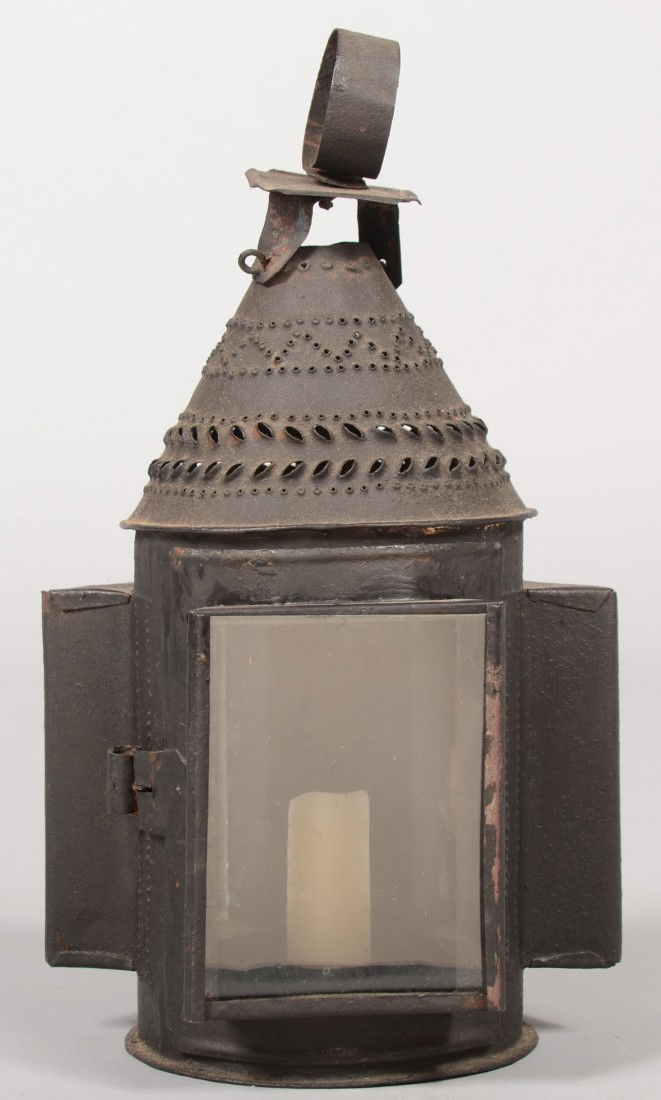 Small Sheet Iron Pierced Decorated Candle Lantern.: Small Sheet Iron Pierced Decorated Candle Lantern. Round body with three square raised bezeled glass lenses. One lens is hinged door. Conical top with multiple vent piercings and small loop handle. Gl