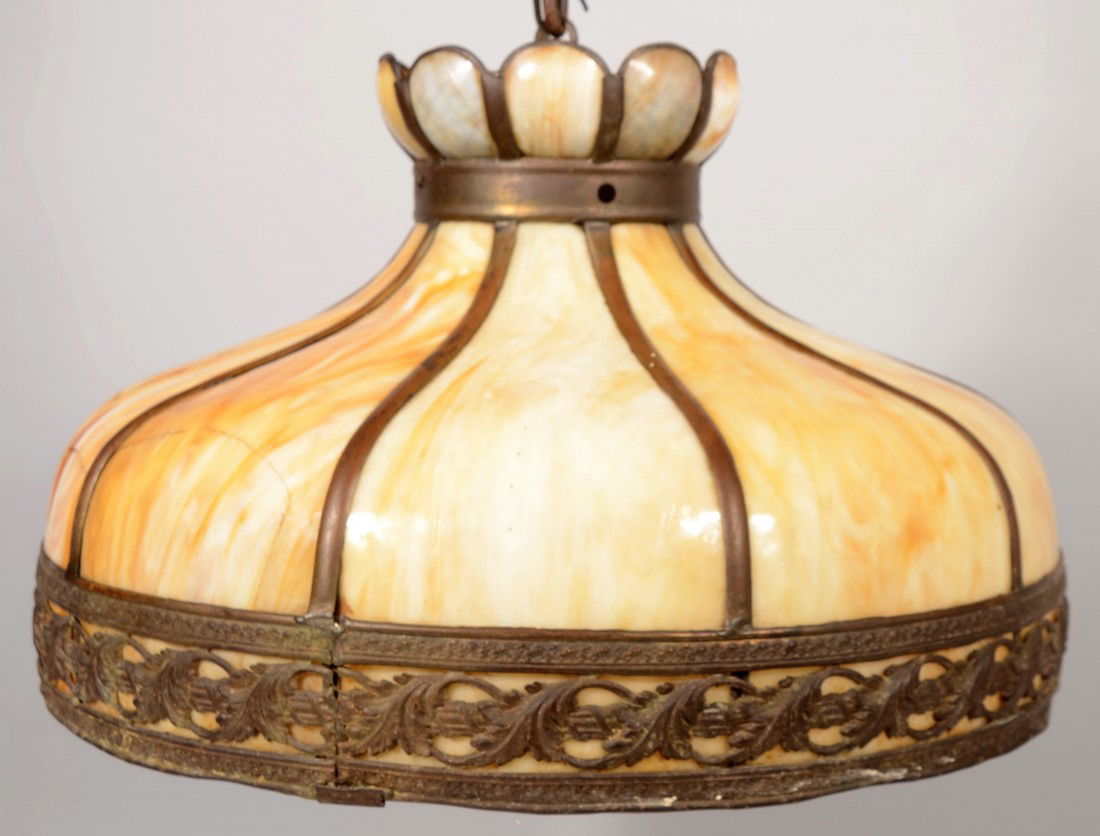 Hanging Sectional Slag Glass Lamp Shade. White and: Hanging Sectional Slag Glass Lamp Shade. White and honey colored glass with brass divider strips, pierced decorative cast brass base border with crowned top. Wired for electric use with ceiling cap, c