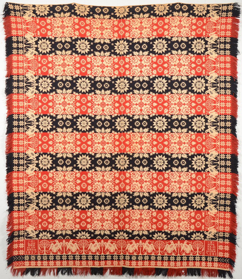 Three Color Wool on Cotton Coverlet. Red and blue : Three Color Wool on Cotton Coverlet. Red and blue wool weft on white cotton warp. Fringed on three sides. Large main field of quatrefoil of roses and sixteen point. No central medallion. Border compos