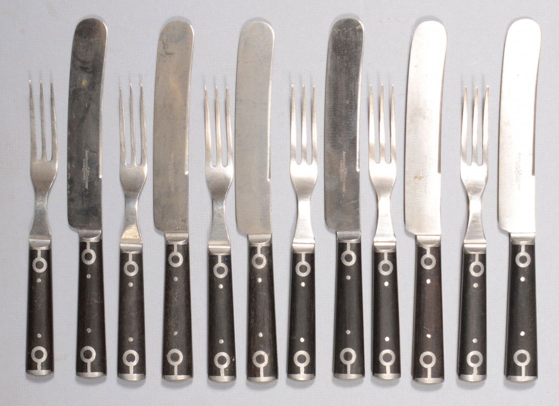 Set of Six Knife and Fork Flatware Pairs. Steel to: Set of Six Knife and Fork Flatware Pairs. Steel tool ends and ebony wood handle slabs with stemmed circle inlays. Marked: "American Cutlery Company, 1865", with Keystone symbol. Knives: 9"l. and forks
