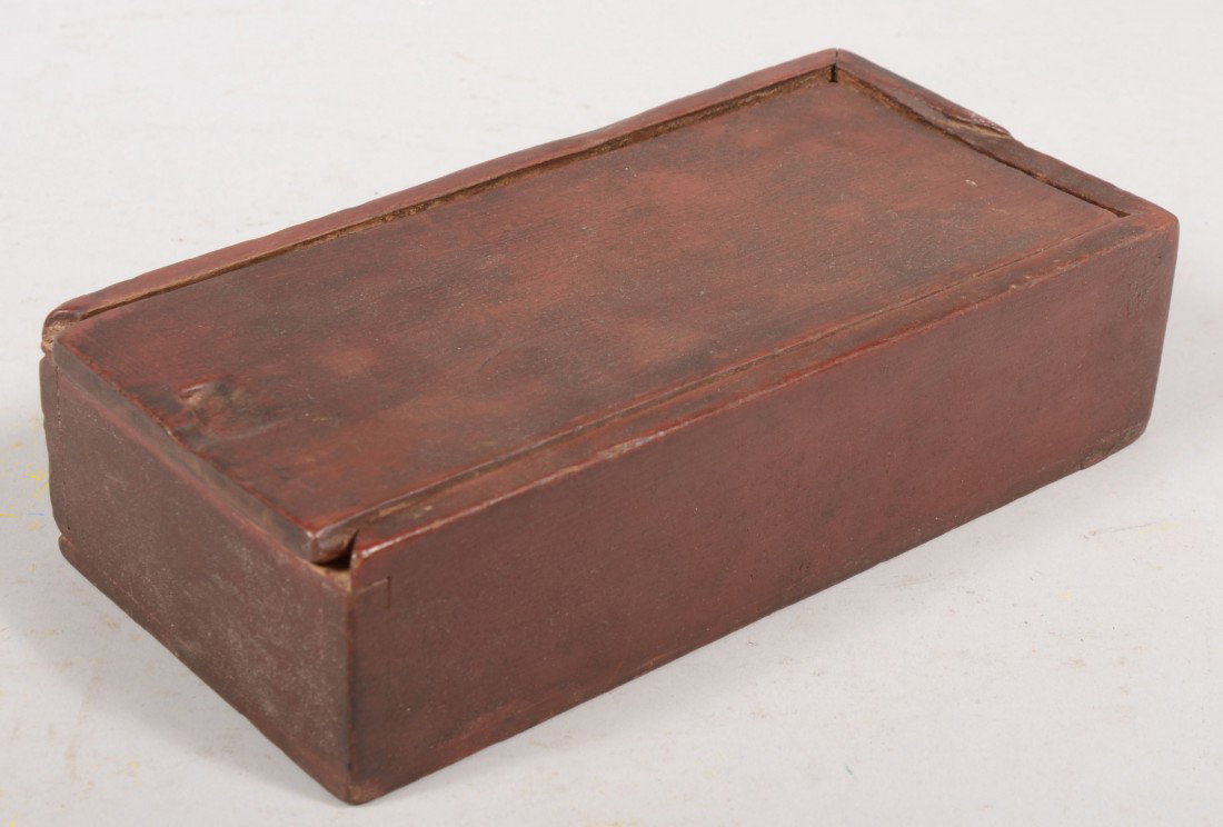 Red Painted and Dovetailed Slide Lid Box. Six sep: Red Painted and Dovetailed Slide Lid Box. Six separate compartments inside. Possibly for coins. 2 1/2"h. X 10"l. X 5"w. Condition: Piece of rim molding missing. Small piece from lid at finger notch.