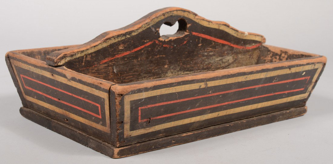 Painted Softwood Utensil Tray. Divided compartment: Painted Softwood Utensil Tray. Divided compartments with handle pierced center board, canted sides with nailed construction. Painted black with red and white striping. Unmarked. 6 3/4"h. X 16"l. X 10 