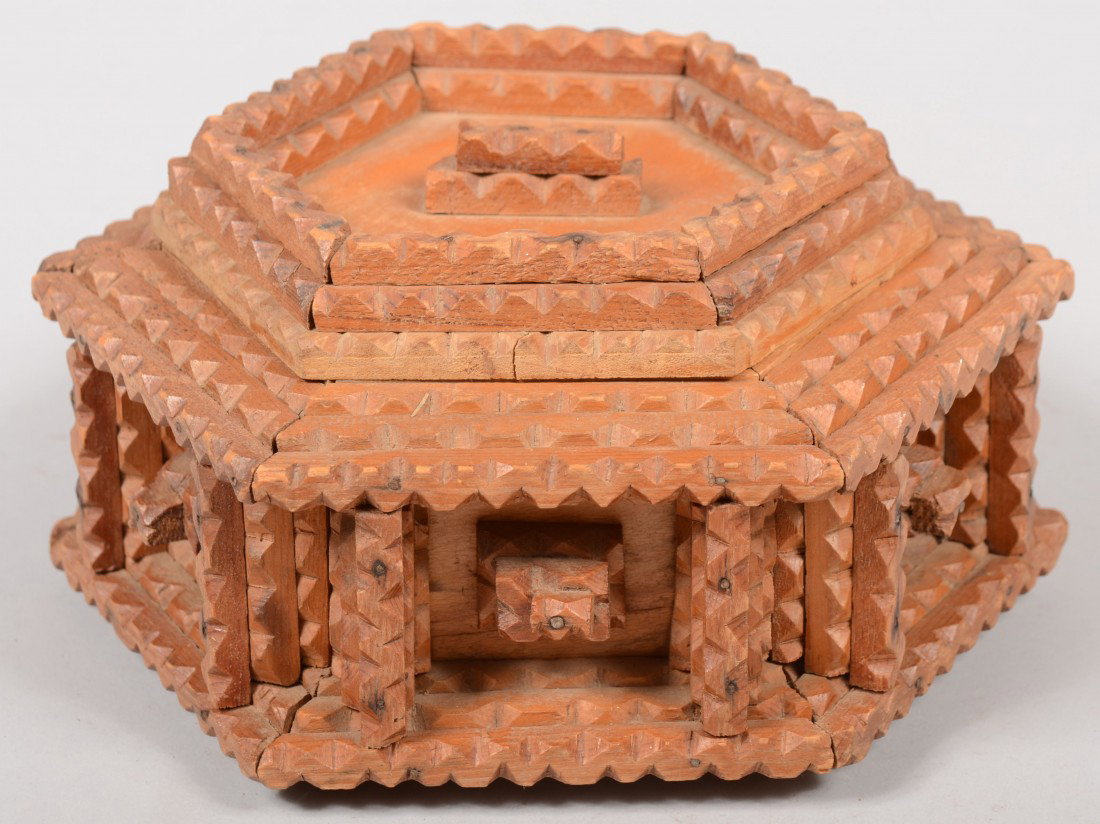 Hexagonal Chip Carved Trinket Box. Coarse style of: Hexagonal Chip Carved Trinket Box. Coarse style of chip carving. Layered and recessed lid with single hinge. Sides of box also layered and recessed with small pyramids in center. 4 5/8"h. X 9 1/2"dia.