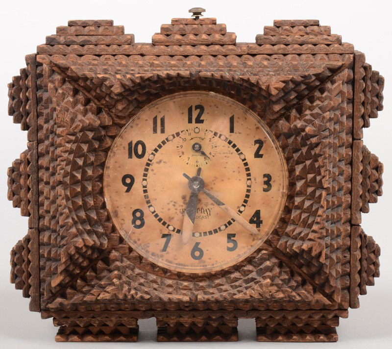 Tramp Art Chip Carved Alarm Clock Case with Clock.: Tramp Art Chip Carved Alarm Clock Case with Clock. Four and five layer strip and contoured pyramids encase a spring driven eight day Broadcast alarm clock mfg. by E. Ingraham of Bristol, Conn. Shut-of