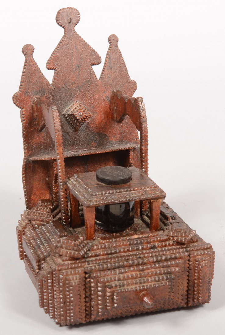 A Dark Stained Tramp Art Pen Stand. Very finely an: A Dark Stained Tramp Art Pen Stand. Very finely and profusely chip carved composition of square and rectangular pyramids providing a platform for an ink bottle, a rack accommodating three nib pens and
