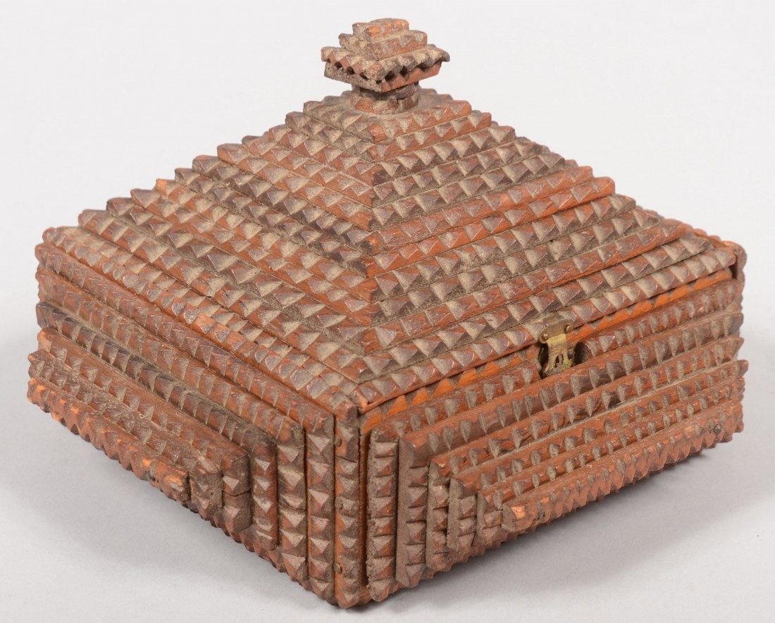 A Tramp Art Pyramid Box. Sides composed of six and: A Tramp Art Pyramid Box. Sides composed of six and seven layer chip carved rectangles. Hinged lid has a twelve layer build with three layer knob finial. Lid includes brass hasp and original gilt stamp