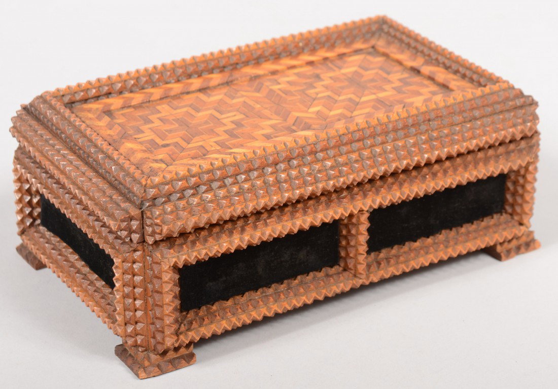 Parquet and Chip Carved Tramp Art Trinket Box. Fin: Parquet and Chip Carved Tramp Art Trinket Box. Fine chip carved strips frame recessed panels with black velvet lining around sides. Box rests on small square feet. Lid composed of similar strip builds