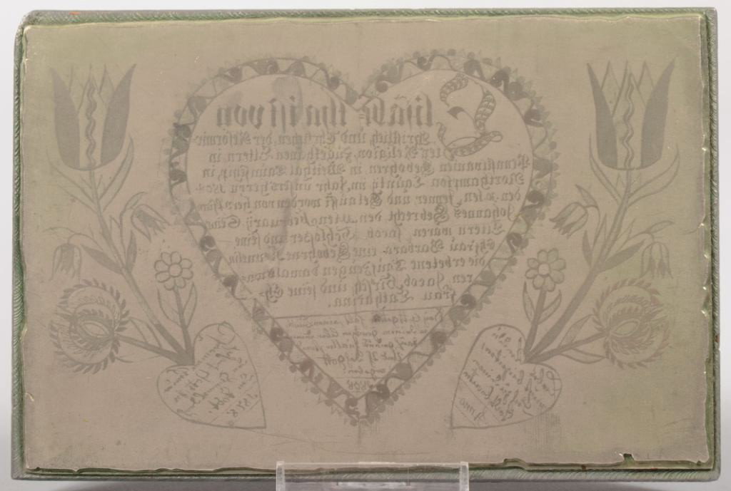 Engraving Plate of a Heart Shaped Fraktur. Text is: Engraving Plate of a Heart Shaped Fraktur. Text is in German and shows dates of 1808 and 1878. Central heart design is flanked by floral stalks with tulips and other flowers. Plate of non-ferrous meta
