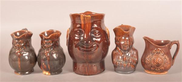 Five Rockingham Glazed Yellowware Toby Pitchers. (1 of 2)