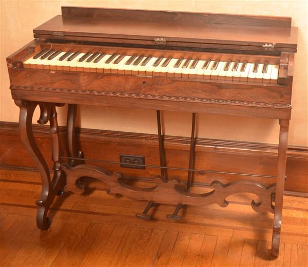 19th Century Rosewood Melodeon.: 19th Century Rosewood Melodeon. Signed Garhart, Needham Co,. NY. 29-1/2"h. x 37"w. x 19"d. Condition: Good, working order.