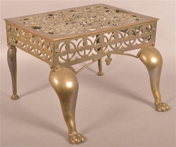 Antique Brass Hearth Footman.: Antique Brass Hearth Footman. Pierced "Star of David" design. 11-1/2"h. x 17"w. x 16"d. Condition: Good with wear.