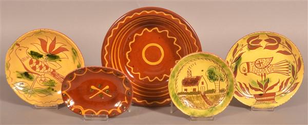 Five Breininger Redware Decorated Plates and Bowl. (1 of 2)