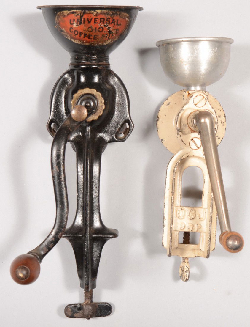 Two Cast Iron Coffee Grinders. Both with table top: Two Cast Iron Coffee Grinders. Both with table top mount clamps, cup bins and cranks. Black unit marked: "Universal Coffee Mill, 010, Landers, Frary & Clark, New Britain, Conn., Patent dated: Feb. 14,
