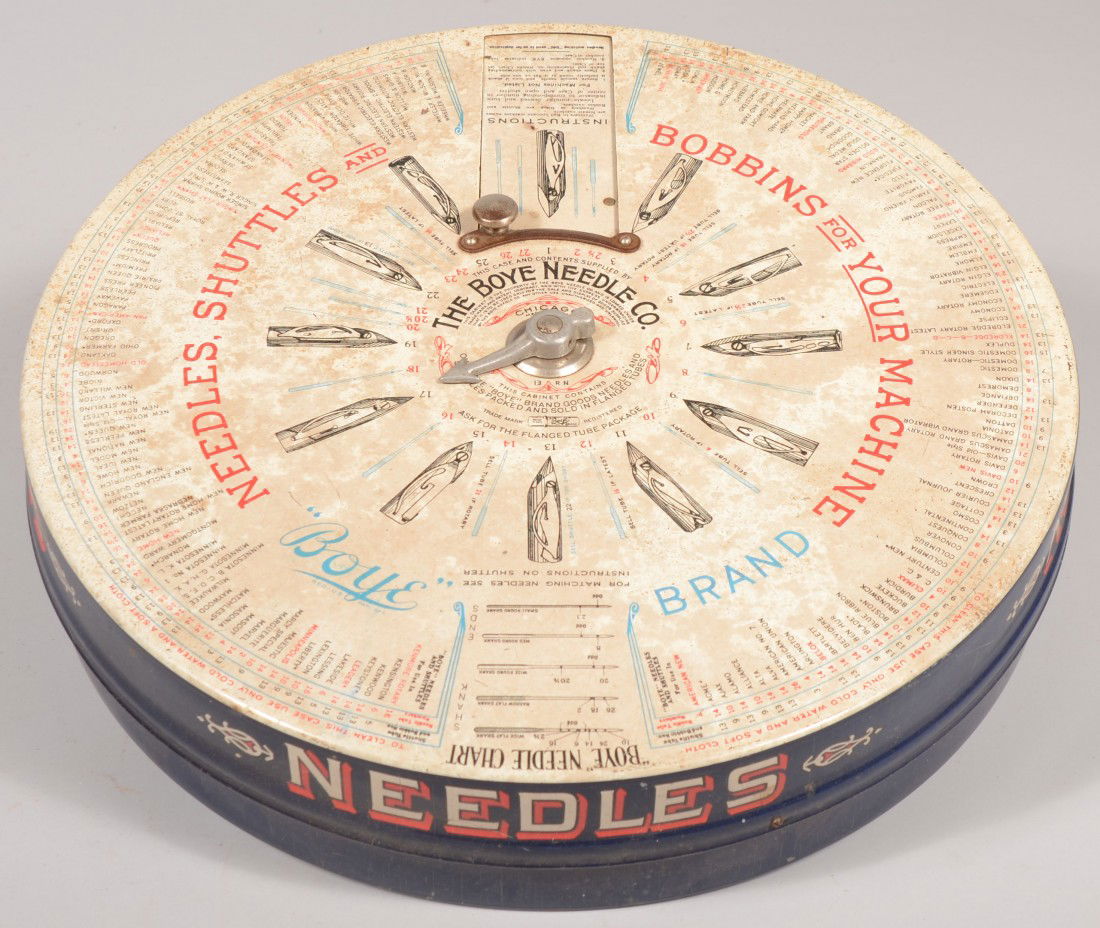 BOYE Brand Needle Company Metal Sales Case. Screen: BOYE Brand Needle Company Metal Sales Case. Screen printed in red white and blue this rotating index is for purchasing sewing machine needles, bobbins and shuttles of the treadle machine era. Contains