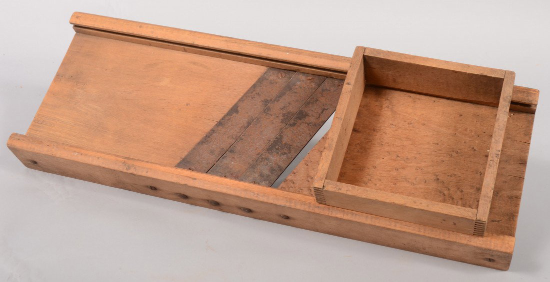 Cabbage or Slaw Cutter. Maple wood frame and deck: Cabbage or Slaw Cutter. Maple wood frame and deck with sliding finger-jointed box, over three adjustable steel blades. Stamped: "Ypsilanti" 26"l. X 9"w.