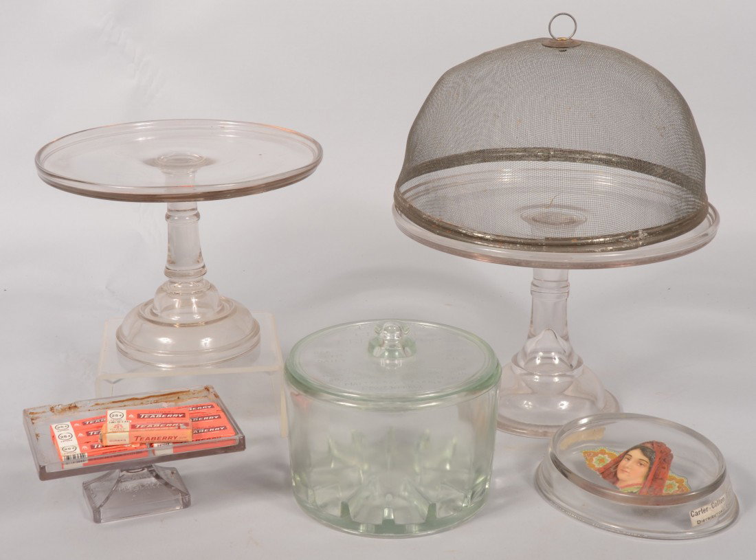 Six Piece Group of Glass Store Accessories. Two ci: Six Piece Group of Glass Store Accessories. Two circular pedestal display stands(cake stands), one with a domed wire fly screen. 8 1/2"h. X 12 1/2"dia. and 8"h. X 10 3/4"dia., fly screen 6 1/2"h. X 12