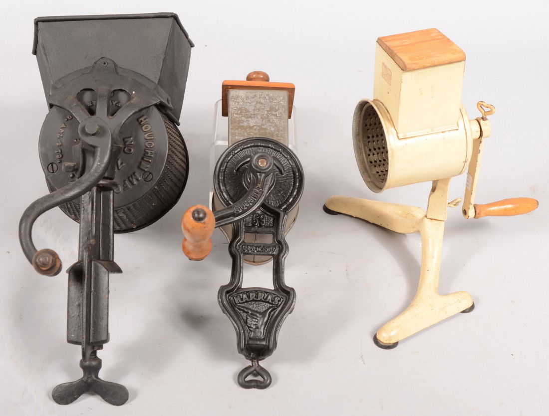 Group of Surface Mounted Cast Iron Graters. A larg: Group of Surface Mounted Cast Iron Graters. A large clamp mounted devise marked: "Houchin Mfg. Co., N.Y., Patd. 1877." 16"h.; a white painted devise with suction cups, unmarked. 11 1/2"h.; a clamp mou