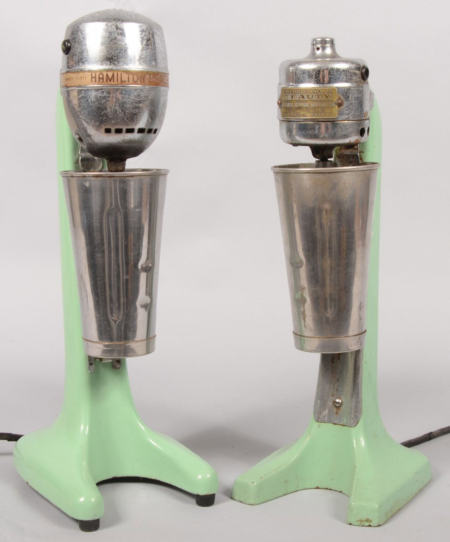 Two Milk Shake Mixer in Green Porcelain Cast Iron.: Two Milk Shake Mixer in Green Porcelain Cast Iron. Both with electric motors, mixing spindle and cups. One marked: "Gilchrist 'Beauty' No.25" circa 1930. 17 3/4"h. Other marked: "Hamilton Beach, Drink